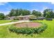 Well-manicured front yard of a charming brick home featuring tidy landscaping at 3405 Leisure Ln, Atlanta, GA 30349