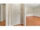 Clean hallway with wood floors and a closet leading to other rooms in the home at 3405 Leisure Ln, Atlanta, GA 30349