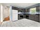 Kitchen featuring modern appliances, tile flooring, and dark cabinets at 3405 Leisure Ln, Atlanta, GA 30349