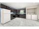 Spacious kitchen includes black appliances, matching cabinets and a convenient laundry area at 3405 Leisure Ln, Atlanta, GA 30349