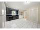 Bright kitchen featuring black cabinets, appliances, and white geometric tile floor at 3405 Leisure Ln, Atlanta, GA 30349