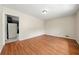 Bright, open living room featuring wood floors and an adjacent kitchen area at 3405 Leisure Ln, Atlanta, GA 30349
