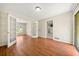 Living room featuring an open doorway and shiny wood flooring at 3405 Leisure Ln, Atlanta, GA 30349