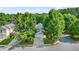 Aerial view of a charming two-story home with mature trees at 3451 Carriage Chase Rd, Atlanta, GA 30349