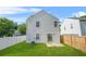 Backyard view of home, showing fenced lawn, sliding glass door, and exterior at 3451 Carriage Chase Rd, Atlanta, GA 30349