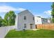 Backyard view of a home with a vinyl fence, sliding glass door, and well-maintained lawn at 3451 Carriage Chase Rd, Atlanta, GA 30349