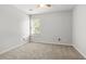 Cozy bedroom with natural light, plush carpeting, and a neutral color scheme at 3451 Carriage Chase Rd, Atlanta, GA 30349