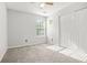 Bright bedroom with a large window and neutral carpet at 3451 Carriage Chase Rd, Atlanta, GA 30349