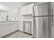 Kitchen featuring stainless steel appliances and white cabinets at 3451 Carriage Chase Rd, Atlanta, GA 30349