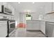 Open concept kitchen with stainless appliances and view to breakfast nook at 3451 Carriage Chase Rd, Atlanta, GA 30349