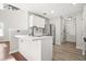 Bright kitchen featuring white cabinets, stainless steel appliances, and modern countertops at 3451 Carriage Chase Rd, Atlanta, GA 30349