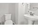 Clean powder room with pedestal sink and modern fixtures at 3451 Carriage Chase Rd, Atlanta, GA 30349