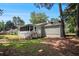 View of home's backyard, features a patio and lots of shade from the surrounding trees at 2780 Highpoint Rd, Snellville, GA 30078