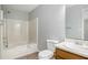 Bathroom features a shower-tub combo, toilet, and sink with modern fixtures at 2780 Highpoint Rd, Snellville, GA 30078