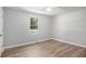 Bedroom with natural light, light wood-look flooring, and neutral paint at 2780 Highpoint Rd, Snellville, GA 30078
