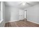 Bedroom with window for natural light, ceiling fan, and light wood-look flooring at 2780 Highpoint Rd, Snellville, GA 30078