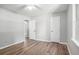 Bedroom featuring light gray walls, a ceiling fan, and light wood-look flooring at 2780 Highpoint Rd, Snellville, GA 30078