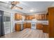 Kitchen featuring wood cabinets, stainless steel dishwasher, and a gas range at 2780 Highpoint Rd, Snellville, GA 30078