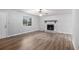 Spacious living room featuring a stone fireplace, ceiling fan, and a large window at 2780 Highpoint Rd, Snellville, GA 30078