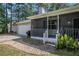 Close up view of the front porch and exterior showing a gas grill and painted siding at 2780 Highpoint Rd, Snellville, GA 30078