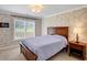 Bedroom with a patterned wall, carpet and view to the backyard at 4715 Mcintosh Drive Dr, Cumming, GA 30040