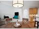 Eat-in kitchen with access to an additional seating area featuring fireplace and mounted television at 4715 Mcintosh Drive Dr, Cumming, GA 30040