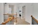Hallway with wood and metal staircase and views to the bedrooms at 4715 Mcintosh Drive Dr, Cumming, GA 30040
