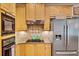 Modern kitchen features stainless steel appliances, granite counters, tile backsplash and gas cooktop at 4715 Mcintosh Drive Dr, Cumming, GA 30040