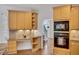 Kitchen workspace features built-in desk area, custom cabinets, and stainless steel appliances at 4715 Mcintosh Drive Dr, Cumming, GA 30040
