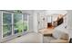 Bright living room featuring large windows, a comfortable chair, hardwood floors and white trim at 4715 Mcintosh Drive Dr, Cumming, GA 30040