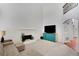 Spacious living room with fireplace, mounted tv, and access to additional rooms at 4715 Mcintosh Drive Dr, Cumming, GA 30040