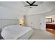 Bright and spacious primary bedroom featuring an attached bathroom and neutral décor at 4715 Mcintosh Drive Dr, Cumming, GA 30040
