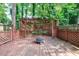 This backyard features a large deck with seating and a fire pit, perfect for outdoor enjoyment at 1002 Creatwood Se Cir, Smyrna, GA 30080