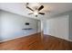 Spacious bedroom with hardwood floors, ceiling fan, and plenty of closet space at 1002 Creatwood Se Cir, Smyrna, GA 30080