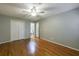 An empty bedroom boasts hard wood flooring, and double closet at 1002 Creatwood Se Cir, Smyrna, GA 30080