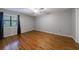 Spacious bedroom with wood flooring and large window to allow natural light at 1002 Creatwood Se Cir, Smyrna, GA 30080