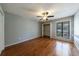 Bright bedroom with hardwood floors, a ceiling fan, and a spacious closet at 1002 Creatwood Se Cir, Smyrna, GA 30080