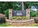 Stone Creatwood at Vinings community sign surrounded by colorful flowers and lush landscaping at 1002 Creatwood Se Cir, Smyrna, GA 30080