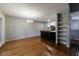Open-concept dining room adjacent to kitchen with hardwood floors at 1002 Creatwood Se Cir, Smyrna, GA 30080