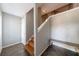 Spacious foyer featuring wood staircase and modern gray walls, leading to upper level at 1002 Creatwood Se Cir, Smyrna, GA 30080