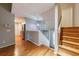 View of foyer, stairs, and entryway with hardwood floors and modern finishes at 1002 Creatwood Se Cir, Smyrna, GA 30080