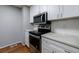 Kitchen with white cabinets, stainless steel appliances, and stylish countertops at 1002 Creatwood Se Cir, Smyrna, GA 30080