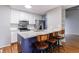 Close-up of kitchen island with marble countertops and stainless steel appliances at 1002 Creatwood Se Cir, Smyrna, GA 30080