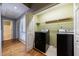 Convenient laundry room with washer, dryer, and plenty of storage space at 1002 Creatwood Se Cir, Smyrna, GA 30080