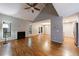 Bright living room featuring hardwood floors, fireplace, and ample natural light at 1002 Creatwood Se Cir, Smyrna, GA 30080