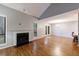 Spacious living room with fireplace, hardwood floors, and bright, open layout at 1002 Creatwood Se Cir, Smyrna, GA 30080