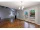 Open living room features hardwood floors, fireplace, and access to outdoor deck at 1002 Creatwood Se Cir, Smyrna, GA 30080