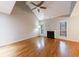 Bright living room featuring vaulted ceilings, fireplace, and hardwood floors at 1002 Creatwood Se Cir, Smyrna, GA 30080