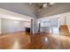 Open-concept living space with hardwood floors and view of kitchen at 1002 Creatwood Se Cir, Smyrna, GA 30080