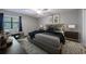 Comfortable main bedroom featuring neutral walls, a ceiling fan, and stylish decor at 1002 Creatwood Se Cir, Smyrna, GA 30080